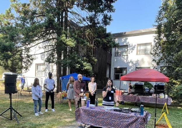 Some members of the Project Team discuss the master planning process with clients and staff from Coast Mental Health at a summer BBQ